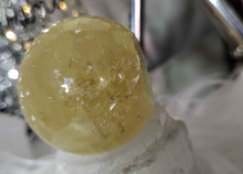 Load image into Gallery viewer, 5&quot; Flat Bottom Rainbow Honey Calcite Sphere on Selenite Stand

