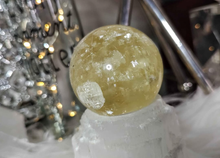 Load image into Gallery viewer, 5&quot; Flat Bottom Rainbow Honey Calcite Sphere on Selenite Stand
