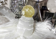 Load image into Gallery viewer, 5&quot; Flat Bottom Rainbow Honey Calcite Sphere on Selenite Stand
